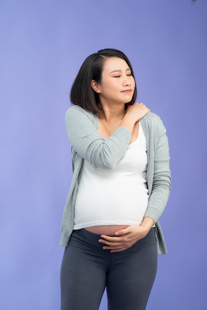 Young pretty Asian pregnant woman