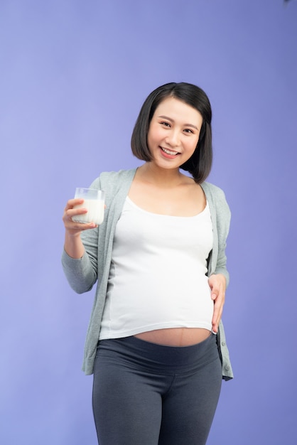 Young pretty Asian pregnant woman