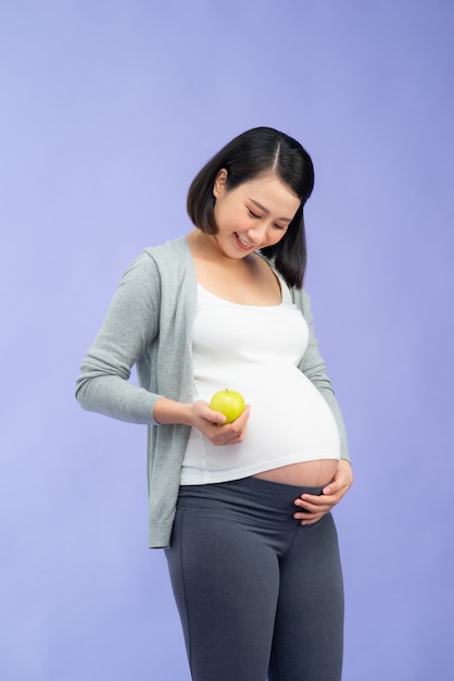 Young pretty Asian pregnant woman