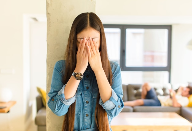 Young pretty asian woman feeling sad, frustrated