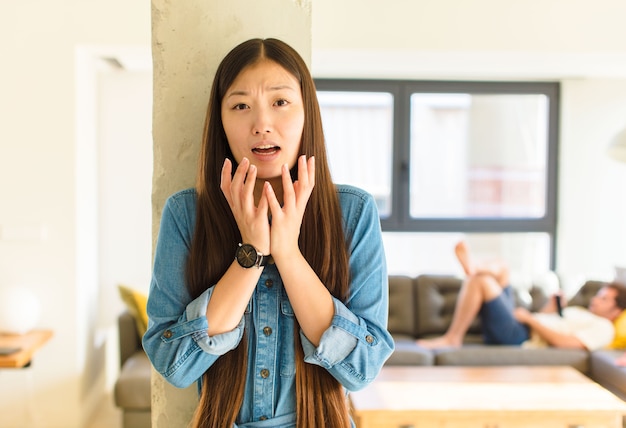 Young pretty asian woman wearing a t-shirt indoors