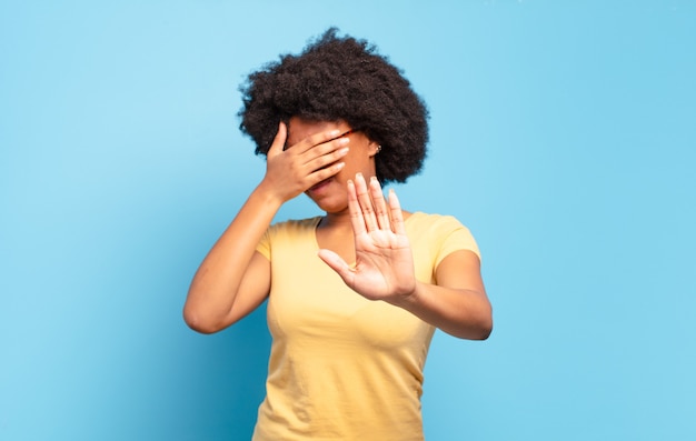 young pretty black woman making a gesture