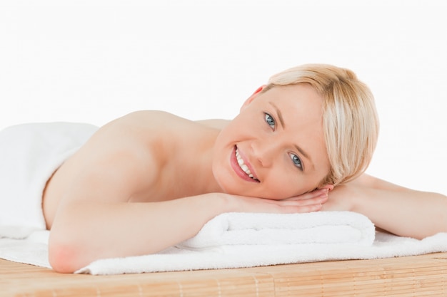 Young pretty blonde woman posing in a spa centre