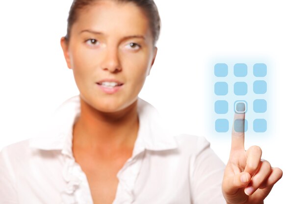 a young pretty businesswoman touching a modern panel over white background