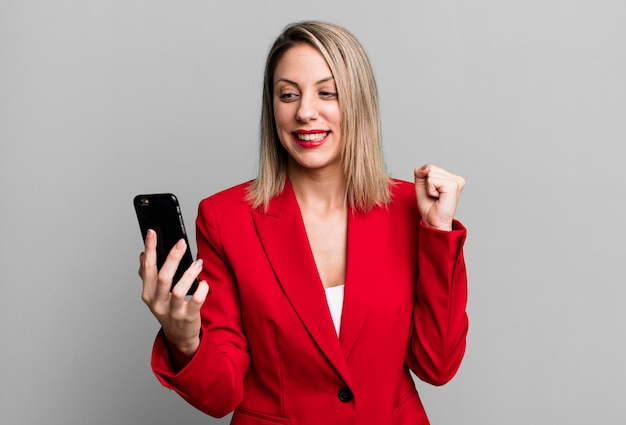 Young pretty businesswoman using her smart phone