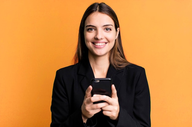 Young pretty businesswoman using her smartphone