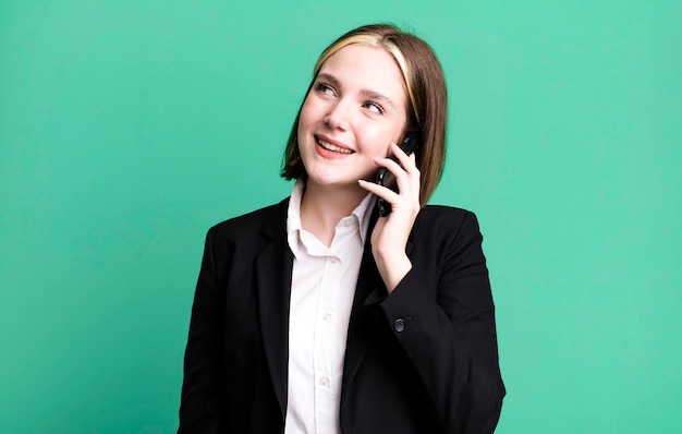 Young pretty businesswoman using her smartphone