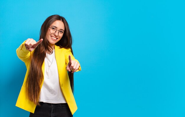 Young pretty businesswoman with a copy space