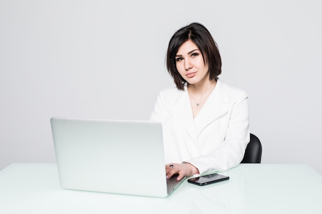 Young pretty Businesswoman with notebook in the office desk