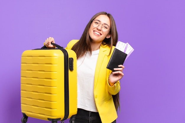 Young pretty businesswoman with a suitcase