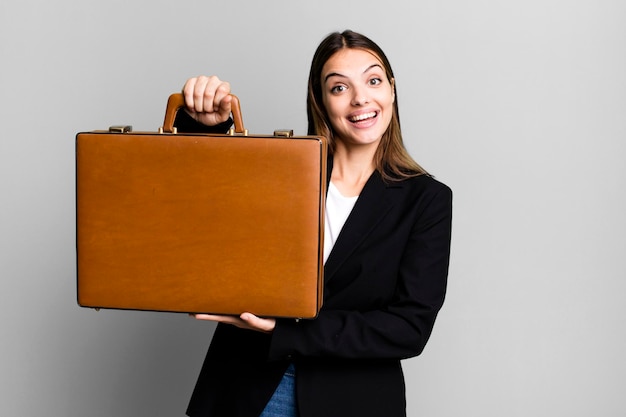 Photo young pretty businesswoman with a suitcase