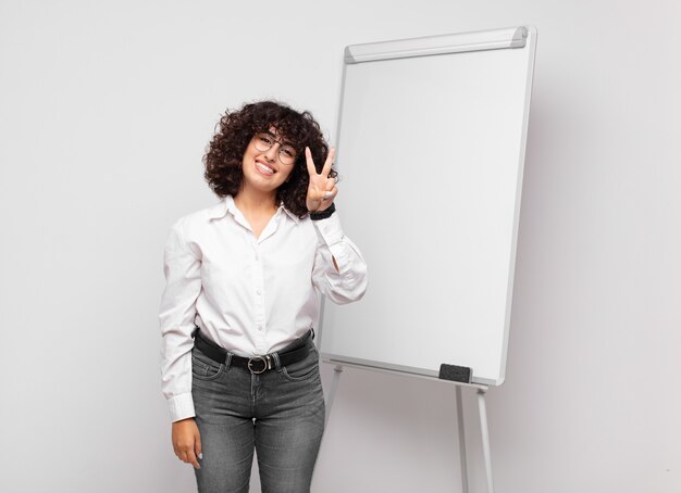 young pretty businesswoman with white board