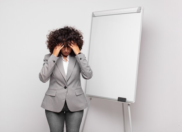 young pretty businesswoman with white board