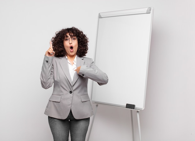 young pretty businesswoman with white board