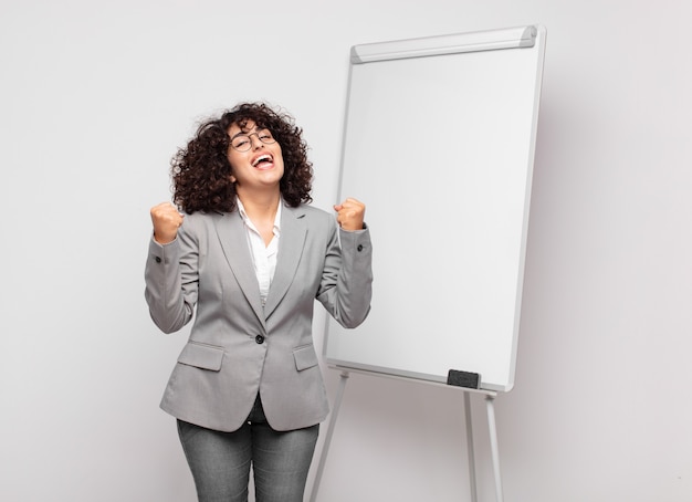 young pretty businesswoman with white board