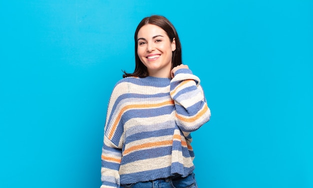 Young pretty casual woman laughing cheerfully and confidently with a casual, happy, friendly smile