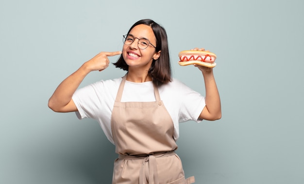 Photo young pretty chef woman. fast food concept