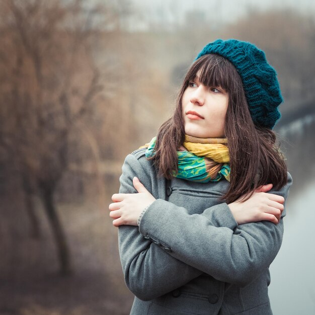 Young pretty girl in cold weather outdoors vintage portrait