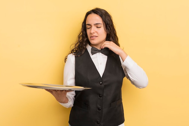 Young pretty hispanic woman feeling stressed, anxious, tired and frustrated. waiter and tray concept