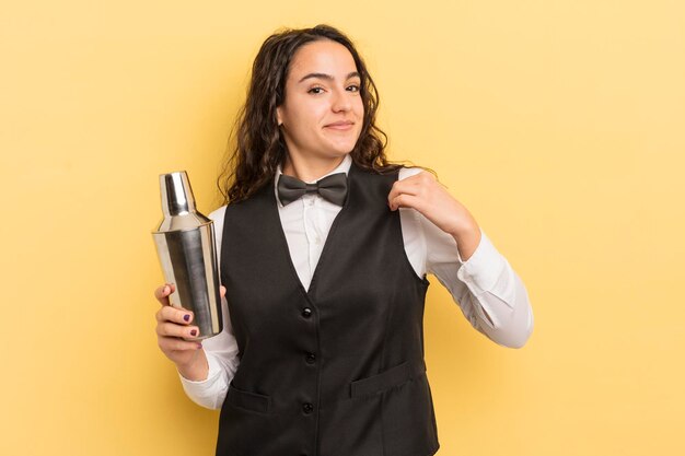 Young pretty hispanic woman looking arrogant successful positive and proud bartender and cocktail concept