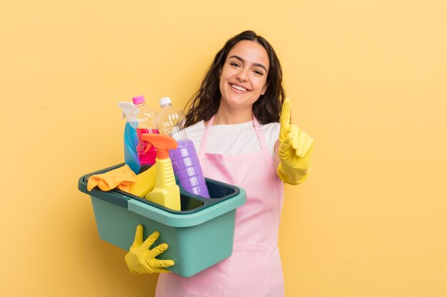 Young pretty hispanic woman smiling and looking friendly showing number one housework an clean products concept