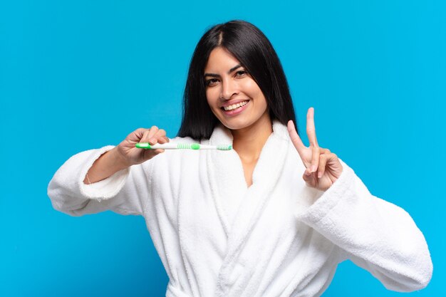 Photo young pretty hispanic woman. with a toothbrush