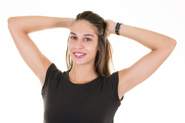 Young pretty positive girl smiling looking camera in white background