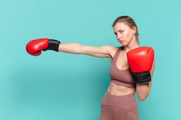 young pretty sport woman angry expression and boxing