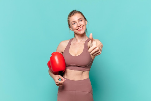 Young pretty sport woman happy expression and boxing