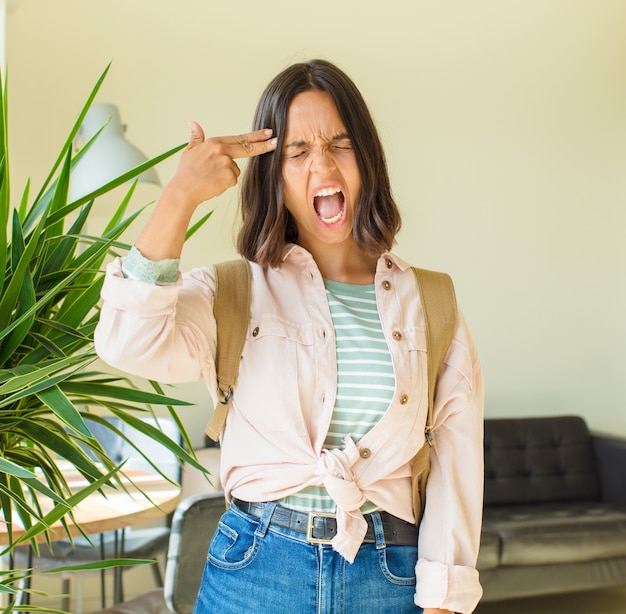 Young pretty student woman at home