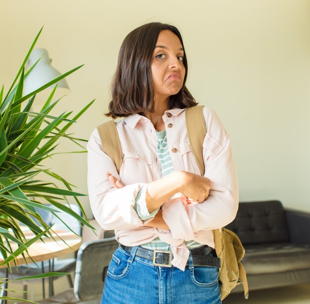 Young pretty student woman at home