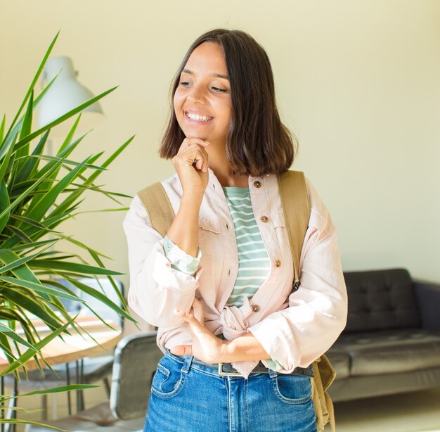 Young pretty student woman at home