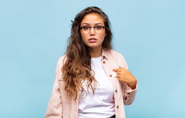 Young pretty woman against isolated background