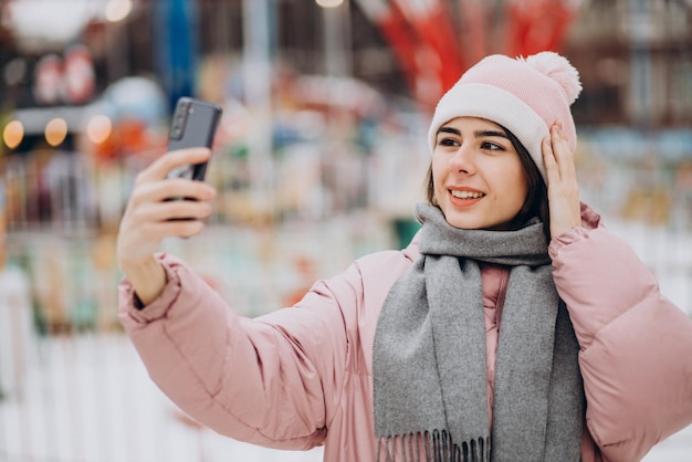 Young pretty woman in an amusement park