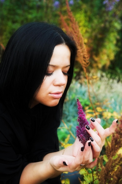 Young pretty woman in autumn park