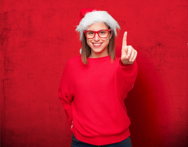 若いきれいな女性クリスマスのコンセプトです。編集可能な背景