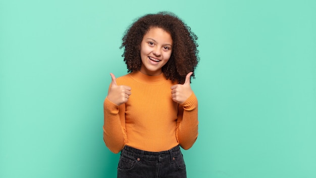 Young pretty woman gesturing on colored wall