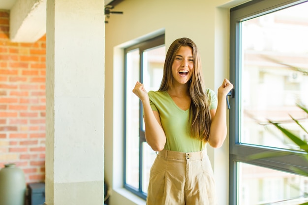 Young pretty woman having fun indoors