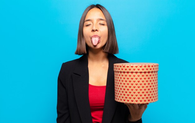 Young pretty woman holding a gift box