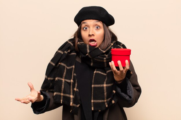 Young pretty woman holding a gift