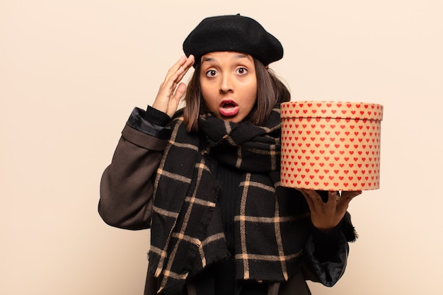 Young pretty woman holding a gift