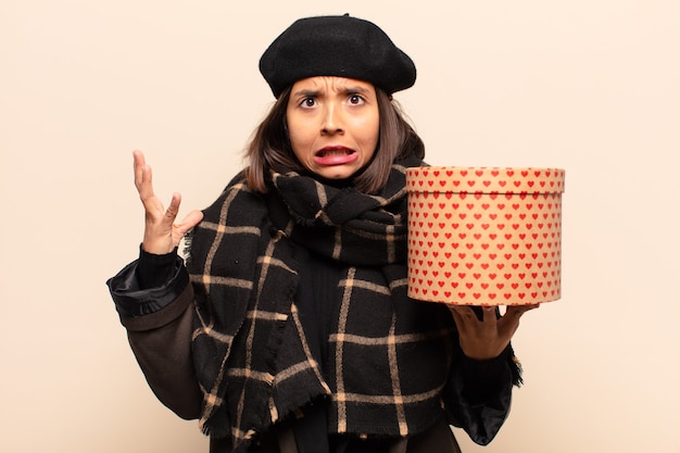 Young pretty woman holding a gift