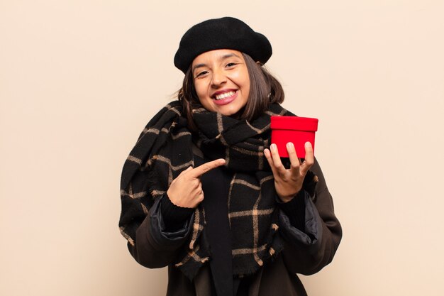 Young pretty woman holding a gift