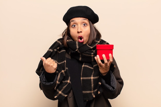 Young pretty woman holding a gift