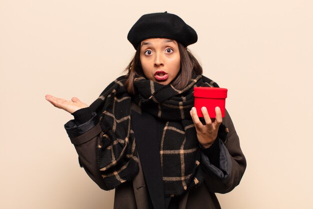 Young pretty woman holding a gift