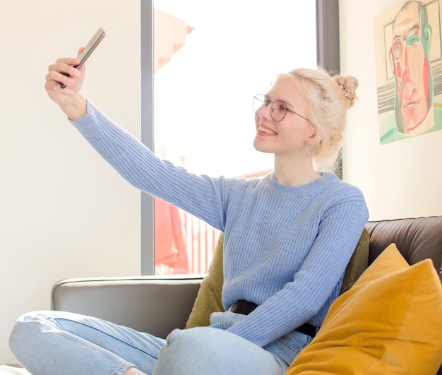 Young pretty woman at home using a telephone