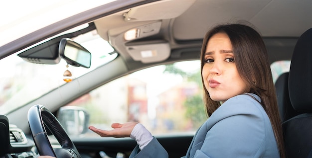 Young pretty woman inside a car