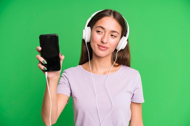 Young pretty woman listening music with her headphones