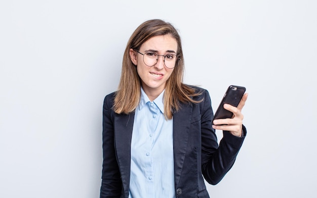 Young pretty woman looking puzzled and confused business concept