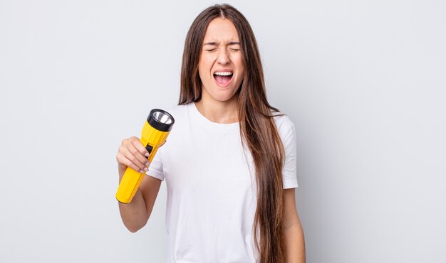 Young pretty woman shouting aggressively, looking very angry. lantern concept